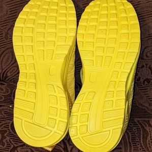 Never worn 100 Footwear yellow sneakers.